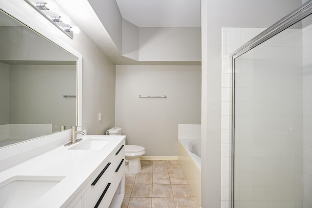 21111 Diamond Rock Ct, Katy, TX 77449 - full bath with a garden tub, toilet, double vanity, a tile shower, and baseboards