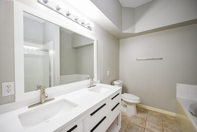 21111 Diamond Rock Ct, Katy, TX 77449 - bathroom with a stall shower, toilet, a garden tub, double vanity, and baseboards