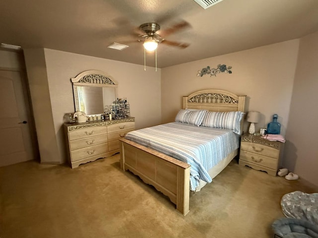 bedroom with ceiling fan and light colored carpet