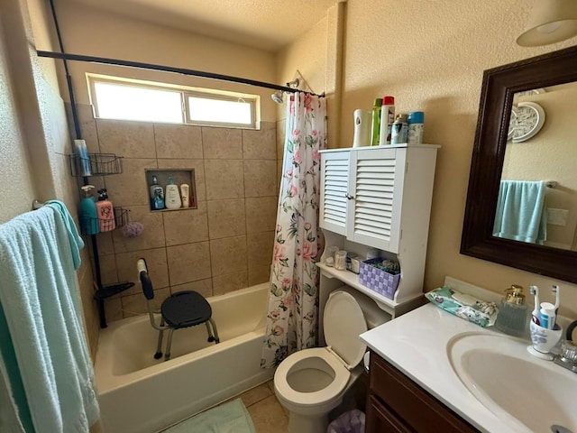 bathroom featuring toilet, tile patterned floors, vanity, and shower / bath combination with curtain