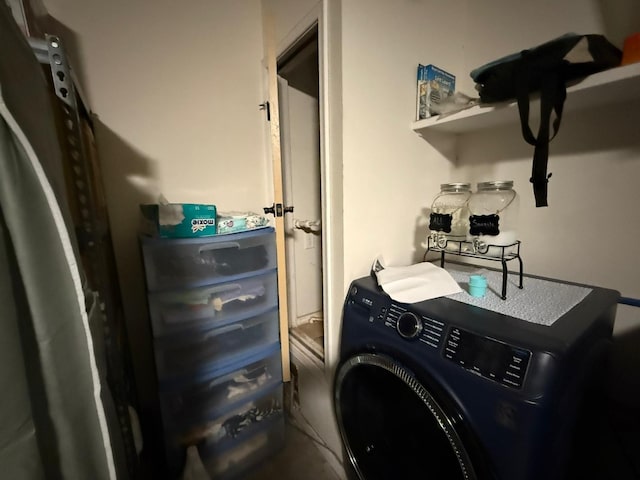 clothes washing area with washer / dryer and laundry area