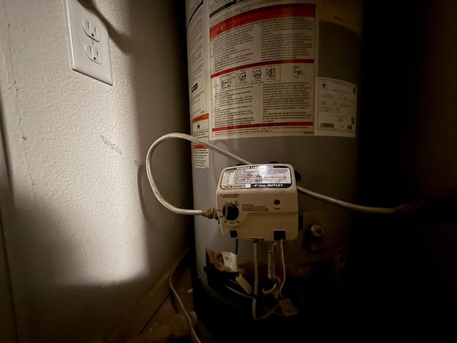utility room featuring gas water heater