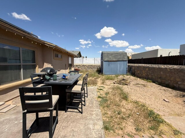 14220 English Point Ave, El Paso, TX 79938 - fenced backyard featuring a shed and an outdoor structure