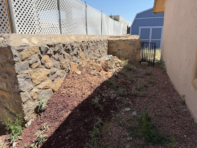 view of yard with a gate and fence