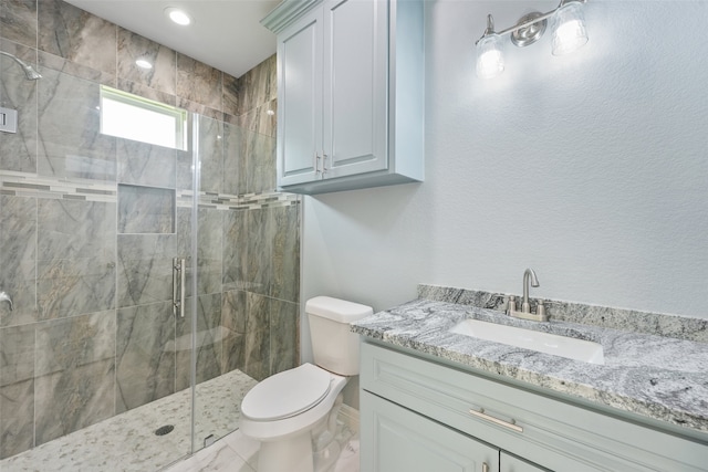 full bath featuring a stall shower, marble finish floor, vanity, and toilet