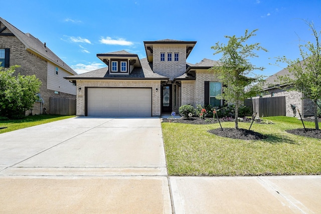 7634 Wrightwood Dr, Pasadena, TX 77505 - prairie-style house featuring fence, an attached garage, a front lawn, and brick siding
