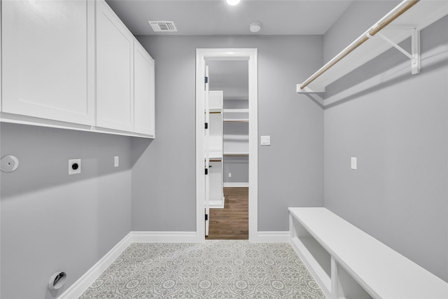 215 Carey Dr, Brenham, TX 77833 - laundry room featuring baseboards, visible vents, cabinet space, and electric dryer hookup