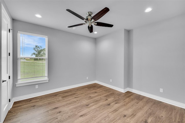 215 Carey Dr, Brenham, TX 77833 - unfurnished room with wood finished floors, baseboards, ceiling fan, and recessed lighting