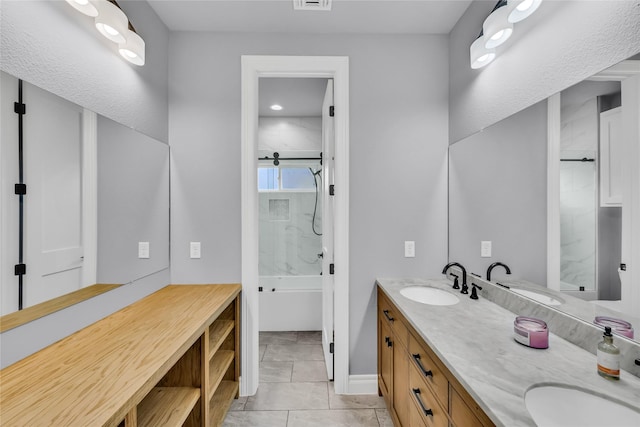 215 Carey Dr, Brenham, TX 77833 - full bathroom featuring bathing tub / shower combination, double vanity, and a sink