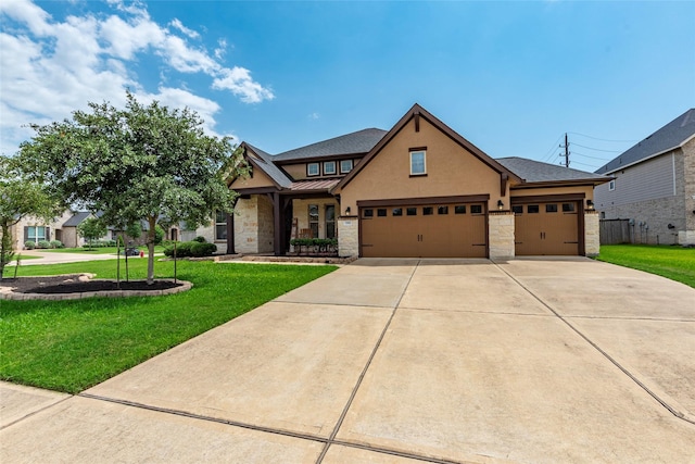 1806 Bridge Gate Ln, Katy, TX 77494 - craftsman-style house featuring an attached garage, stone siding, concrete driveway, a front yard, and a standing seam roof