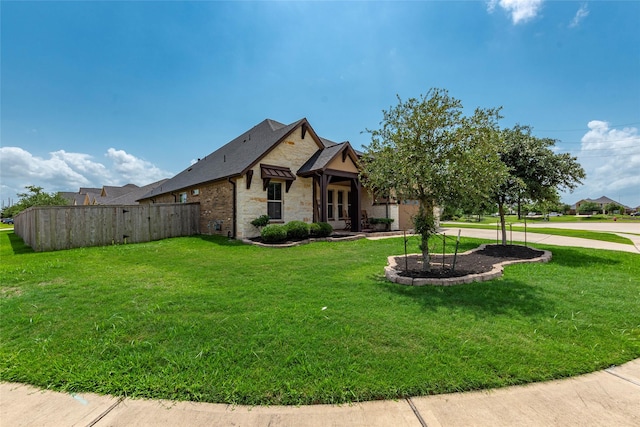 1806 Bridge Gate Ln, Katy, TX 77494 - view of front of property with stone siding, fence, and a front yard