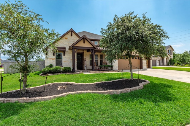 1806 Bridge Gate Ln, Katy, TX 77494 - view of front facade with stone siding, an attached garage, fence, a front yard, and driveway