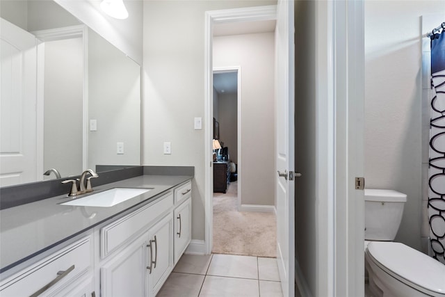 1806 Bridge Gate Ln, Katy, TX 77494 - bathroom featuring vanity, toilet, baseboards, and tile patterned flooring