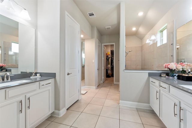 1806 Bridge Gate Ln, Katy, TX 77494 - bathroom featuring two vanities, visible vents, a sink, and a walk in shower