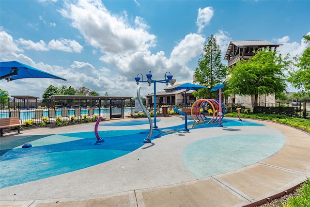 1806 Bridge Gate Ln, Katy, TX 77494 - exterior space featuring fence, playground community, and a swimming pool