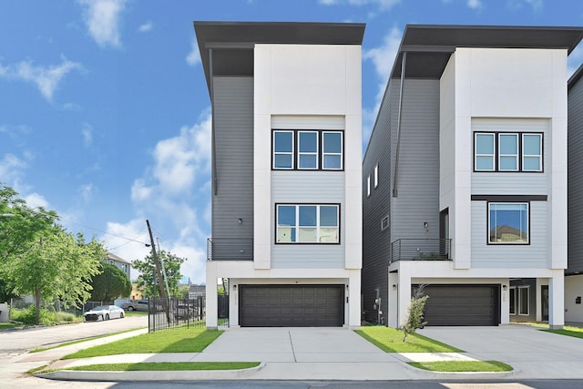 3313 Baer St, Houston, TX 77020 - contemporary home featuring an attached garage, concrete driveway, and stucco siding