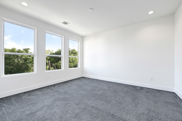 3313 Baer St, Houston, TX 77020 - spare room featuring dark colored carpet, recessed lighting, and baseboards