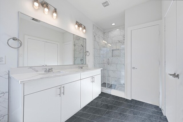 3313 Baer St, Houston, TX 77020 - full bath featuring a marble finish shower, double vanity, tile patterned floors, and recessed lighting