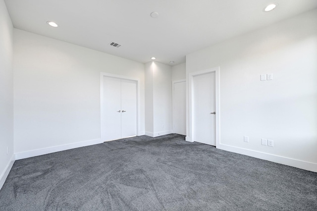3313 Baer St, Houston, TX 77020 - empty room featuring dark carpet, recessed lighting, and baseboards