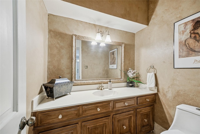 2002 Anvil Dr, Houston, TX 77090 - bathroom with toilet, vanity, and a textured wall