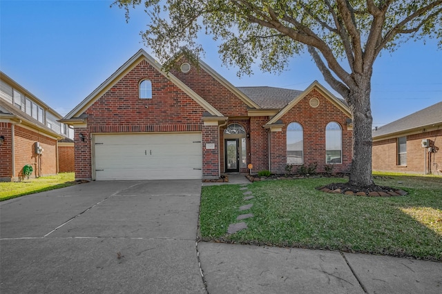 2107 Auburn Vale St, Katy, TX 77493 - traditional-style house featuring concrete driveway, an attached garage, brick siding, and a front yard