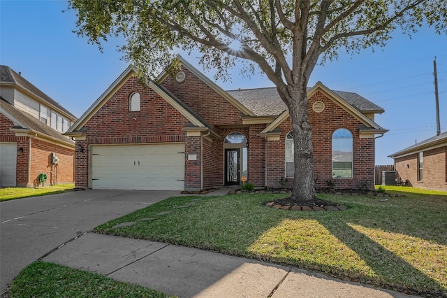 2107 Auburn Vale St, Katy, TX 77493 - traditional-style house featuring brick siding, central AC, concrete driveway, a garage, and a front yard