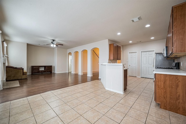 2107 Auburn Vale St, Katy, TX 77493 - kitchen with light countertops, light tile patterned floors, visible vents, and ceiling fan