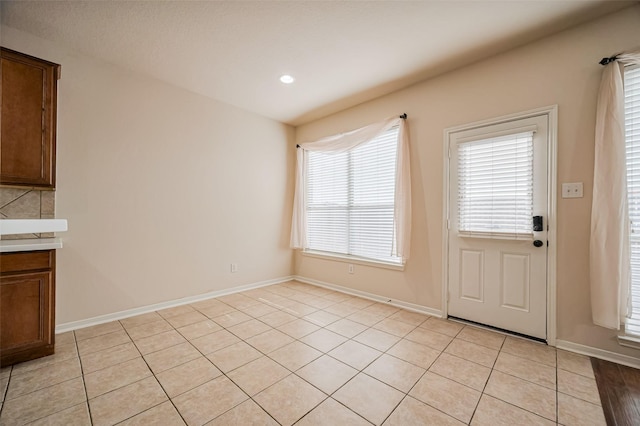 2107 Auburn Vale St, Katy, TX 77493 - unfurnished dining area with light tile patterned floors, baseboards, and recessed lighting
