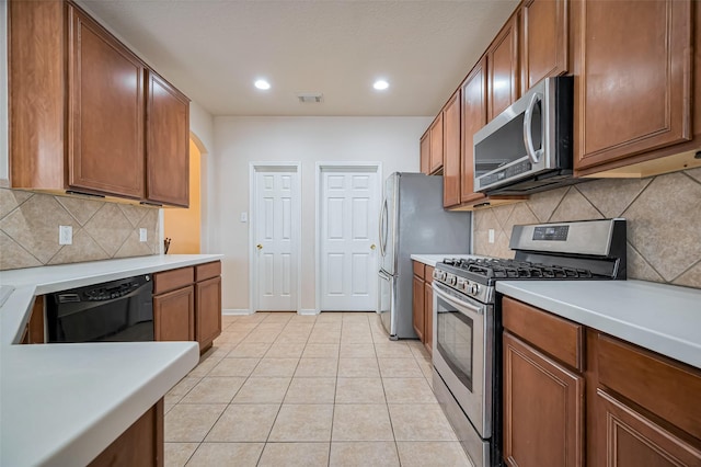2107 Auburn Vale St, Katy, TX 77493 - kitchen featuring light countertops, decorative backsplash, stainless steel appliances, and recessed lighting