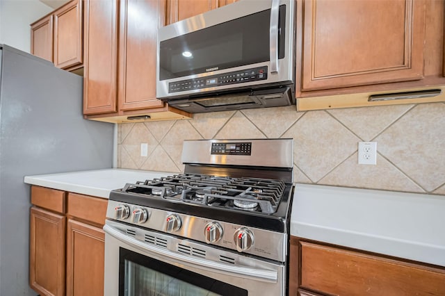 2107 Auburn Vale St, Katy, TX 77493 - kitchen with stainless steel appliances, decorative backsplash, light countertops, and brown cabinets