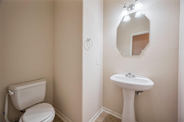 2107 Auburn Vale St, Katy, TX 77493 - bathroom with toilet, tile patterned flooring, and baseboards