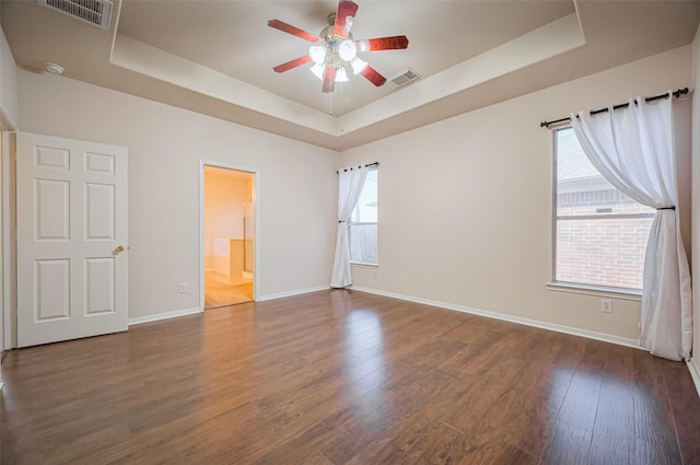 2107 Auburn Vale St, Katy, TX 77493 - unfurnished bedroom featuring a raised ceiling, baseboards, and visible vents