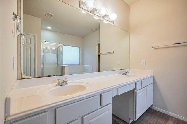 2107 Auburn Vale St, Katy, TX 77493 - full bathroom with double vanity, visible vents, a stall shower, and a sink