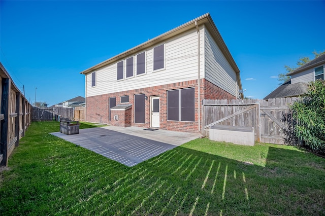 2107 Auburn Vale St, Katy, TX 77493 - back of property featuring a yard, brick siding, a fenced backyard, and a patio area