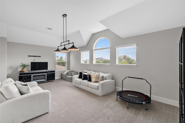 10610 Grace Hollow Dr, Cypress, TX 77433 - living room featuring vaulted ceiling, carpet flooring, baseboards, and visible vents