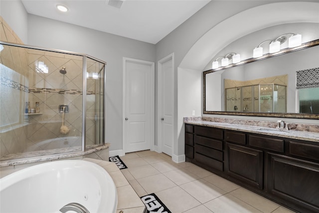 10610 Grace Hollow Dr, Cypress, TX 77433 - full bath with a whirlpool tub, visible vents, a shower stall, tile patterned floors, and vanity