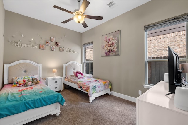 10610 Grace Hollow Dr, Cypress, TX 77433 - carpeted bedroom featuring visible vents, baseboards, and ceiling fan