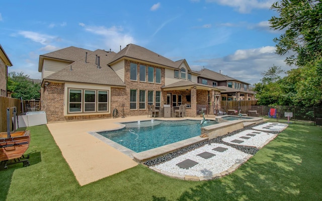 10610 Grace Hollow Dr, Cypress, TX 77433 - rear view of house featuring an outdoor kitchen, brick siding, a patio area, a shingled roof, and a fenced backyard