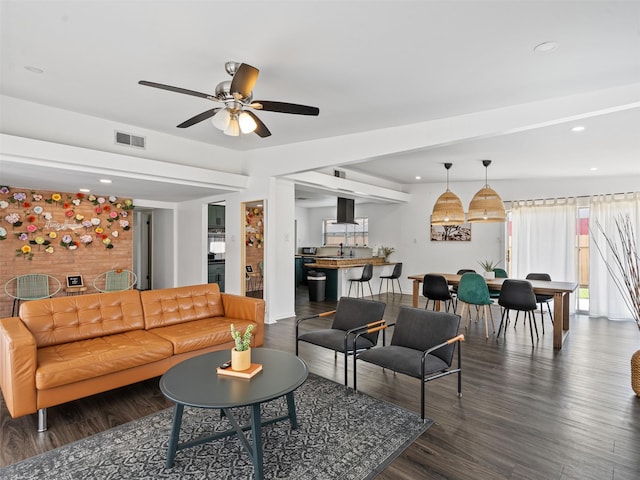 living area featuring dark wood finished floors, visible vents, a ceiling fan, and recessed lighting