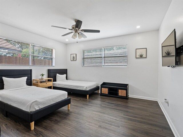 bedroom with baseboards, multiple windows, recessed lighting, and dark wood-style flooring