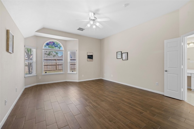 22022 Bridgestone Hawk Ct, Spring, TX 77388 - unfurnished room featuring baseboards, dark wood-style flooring, ceiling fan, visible vents, and vaulted ceiling