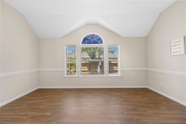 22022 Bridgestone Hawk Ct, Spring, TX 77388 - unfurnished room with baseboards, wood finished floors, and lofted ceiling
