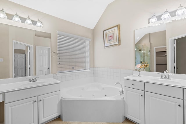 22022 Bridgestone Hawk Ct, Spring, TX 77388 - full bath featuring a shower stall, lofted ceiling, two vanities, and a sink