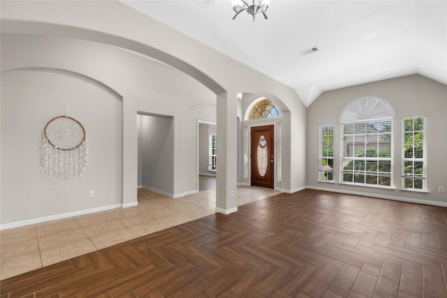22022 Bridgestone Hawk Ct, Spring, TX 77388 - entryway with visible vents, baseboards, lofted ceiling, and arched walkways