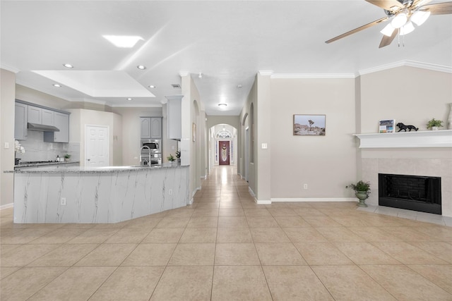 22022 Bridgestone Hawk Ct, Spring, TX 77388 - kitchen featuring light tile patterned floors, a ceiling fan, gray cabinets, backsplash, and recessed lighting