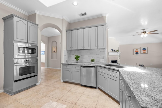 22022 Bridgestone Hawk Ct, Spring, TX 77388 - kitchen with crown molding, a sink, appliances with stainless steel finishes, and gray cabinetry