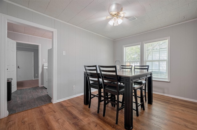 161281/2 Ridlon St, Channelview, TX 77530 - dining area with ornamental molding, a ceiling fan, wood finished floors, and baseboards
