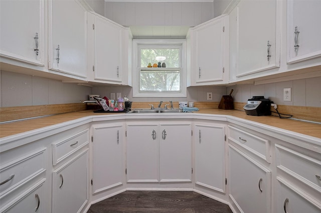 161281/2 Ridlon St, Channelview, TX 77530 - kitchen featuring a sink, white cabinetry, light countertops, and dark wood finished floors