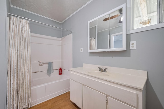 161281/2 Ridlon St, Channelview, TX 77530 - full bathroom with crown molding, wood finished floors, vanity, shower / tub combo, and a textured ceiling
