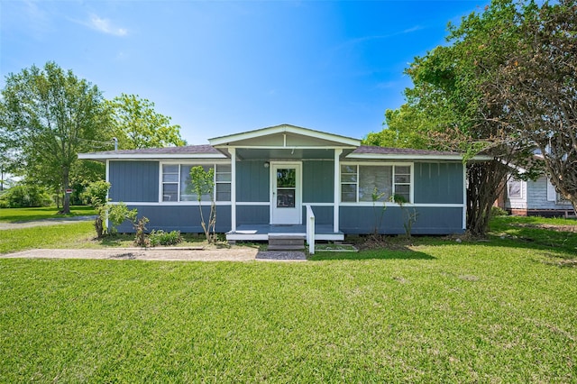 161281/2 Ridlon St, Channelview, TX 77530 - ranch-style home with a porch, a front yard, and roof with shingles